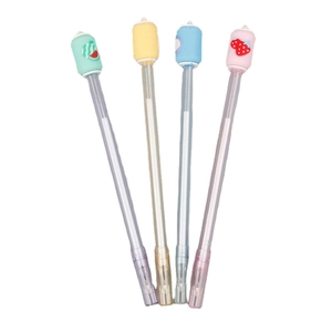 Set of four retractable ballpoint pens with cartoon fruit silicone toppers on white background