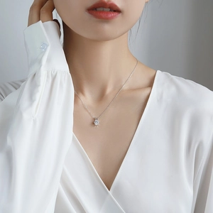 Elegant 1 carat Moissanite pendant necklace in S925 sterling silver worn by a model