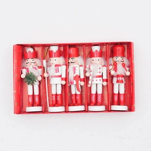 Detailed set of five red and white wooden Christmas nutcrackers in a festive gift box
