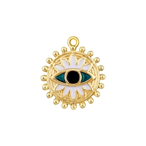 Macro shot of gold-plated evil eye pendant with white and green enamel details