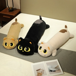 Three plush long cat body pillows in brown, black, and beige on a cozy bed