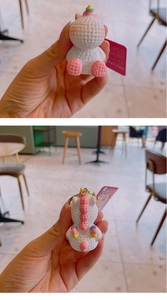Detailed front and back view of a cute white unicorn keychain with pink knitted texture
