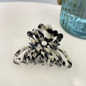 Elegant floral acetate hair claw clip with rhinestones and black white pattern