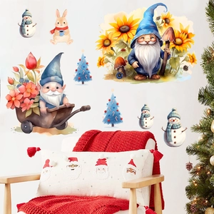 Detail of watercolor Christmas wall stickers featuring gnomes, snowmen and bunnies on a wall