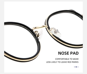 Détails des plaquettes de nez en silicone sur montures de lunettes rondes noir et or