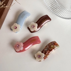 Acetate flower hair clips with crystals and gold lettering in four elegant colors