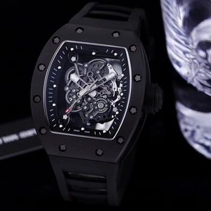 Skeleton tonneau mechanical watch with black rubber strap and luxury exposed movement