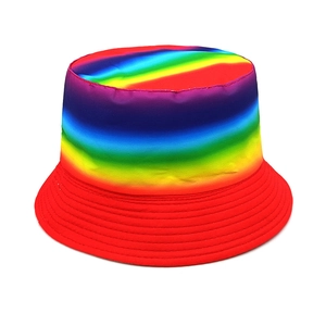 Detailed macro view of the rainbow striped knit fabric and red brim on the kids sun hat