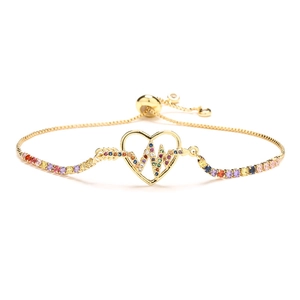 Gold adjustable heart bracelet with rainbow cubic zirconia and EKG pulse design