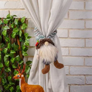 Macro view of Christmas gnome curtain tieback showing festive holly and fur detail