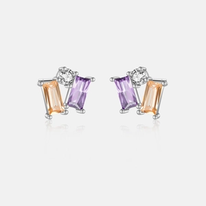 Macro detail of S925 silver earrings with purple and orange square gemstones