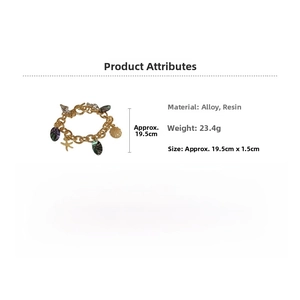 Detail view of gold ocean charms bracelet with seashell and starfish resin pendants