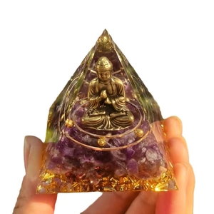 Handmade Orgone Pyramid with gold Buddha, amethyst stones, and copper coil energy crystal