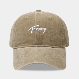Detail of embroidered Funny cursive text on washed cotton vintage khaki baseball cap