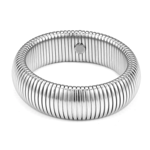 Detailed close-up of a silver Tubogas style elastic stainless steel coil bracelet