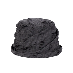 Distressed dark grey bucket hat with ripped details and a vintage nomadic street style look