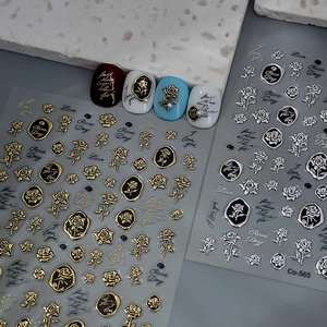 3D metallic rose nail art stickers in gold and silver with elegant embossed floral patterns