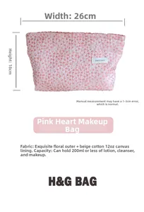 Pink heart patterned makeup bag measuring 26x18cm with canvas lining for toiletries