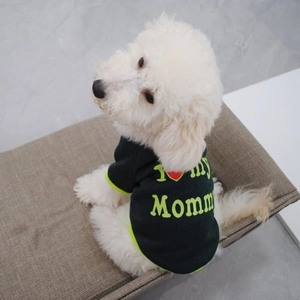 Detail of black dog fleece sweater featuring I Love My Mommy print and green trim
