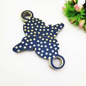Flat lay of unfolded dark blue gold polka dot gift boxes with pink floral accents