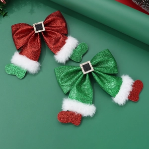 Detail of glitter Christmas hair bows with faux fur trim and holiday charms