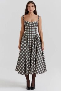 Detail of vintage French corset dress with classic British red and green plaid patterns