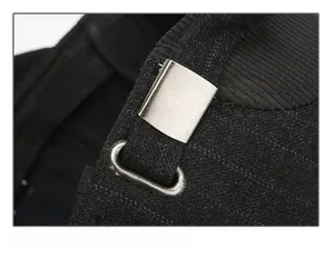 Detail of adjustable metal buckle and woven strap on a men's wool baseball cap