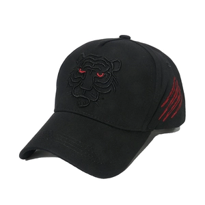 Black baseball cap featuring tiger head embroidery and red scratch details on the side