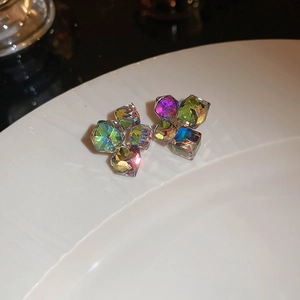 Macro shot of colorful cubic zirconia heart-shaped flower earrings with vibrant facets