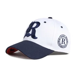 Fashionable contrast baseball cap with navy R embroidery and star badge on white background