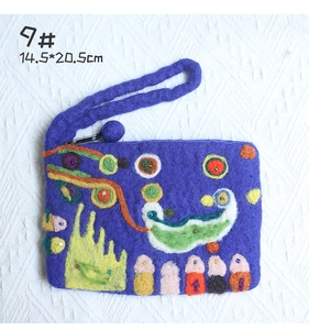 Detail of purple handmade wool felt bag with colorful pattern and 14.5x20.5cm dimensions