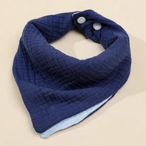 Detail of soft 4-layer cotton gauze baby bib with secure white adjustable snap buttons