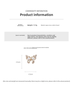 Detailed view of 18k gold butterfly brooch with white shell and zircon inlay measurements
