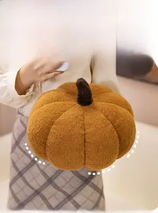 Detail of soft pumpkin plush pillow made of caramel-colored sherpa fleece fabric