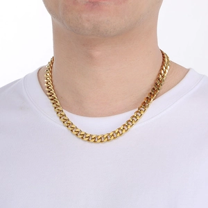 Male model wearing a classic polished gold Cuban link chain necklace in stainless steel