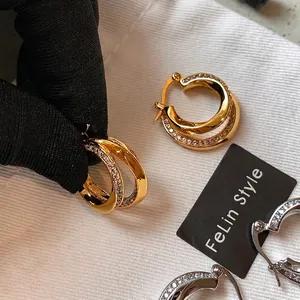 Double-layered geometric round hoop earrings with sparkling zircon crystals in gold and silver
