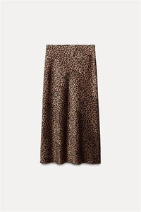 Detailed view of satin midi skirt fabric with brown leopard print and A-line silhouette