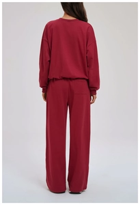 Back view of burgundy wide-leg joggers with a rear pocket for a relaxed athletic fit
