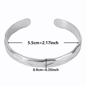 Detail view of silver hammered texture cuff bracelet with size dimensions 5.5cm by 0.9cm