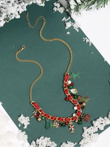 Detailed Christmas charm necklace with gingerbread man, bell and candy cane on red ribbon