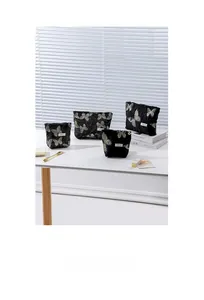 Macro view showing four Chinese style cosmetic bags with gold butterfly embroidery details