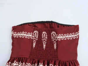 Detail view of ethnic print bodice with elastic smocking and hidden zipper closure