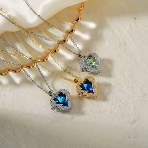 Three gold and silver heart necklaces with vibrant cubic zirconia stones and hollow design