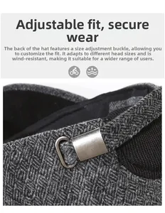 Detail of adjustable metal buckle and herringbone fabric on a winter cap for men