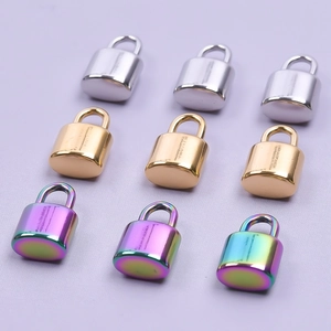 Mini stainless steel oval padlocks in silver, gold, and rainbow finishes on purple background