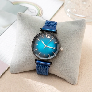 Elegant women's quartz watch featuring a blue gradient dial and magnetic mesh strap