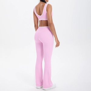 Rear view of pink yoga set with contrast piping and flared high waist leggings