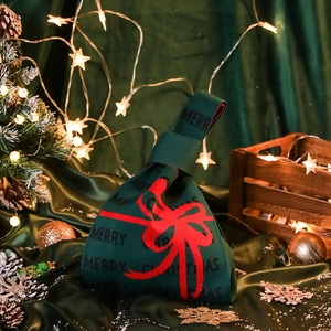 Green knit Christmas gift bag with red bow pattern and Merry Christmas text design