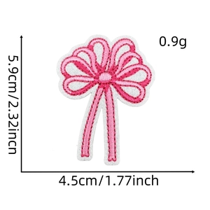Detail showing dimensions and macro texture of the pink bow embroidered patch