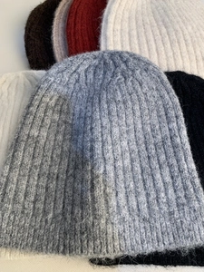 Detail of wool blend ribbed knit hats showing soft fuzzy texture and various colors